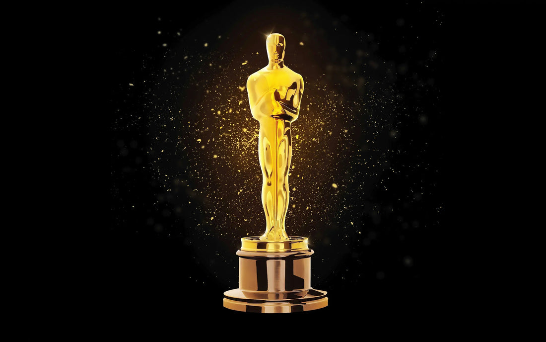 An Oscar Aware in front of a black background