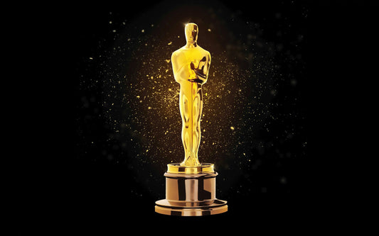 An Oscar Aware in front of a black background